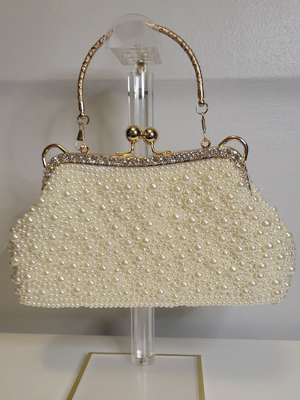 Pearl-Embellished Ivory Evening Bag with Gold Accents